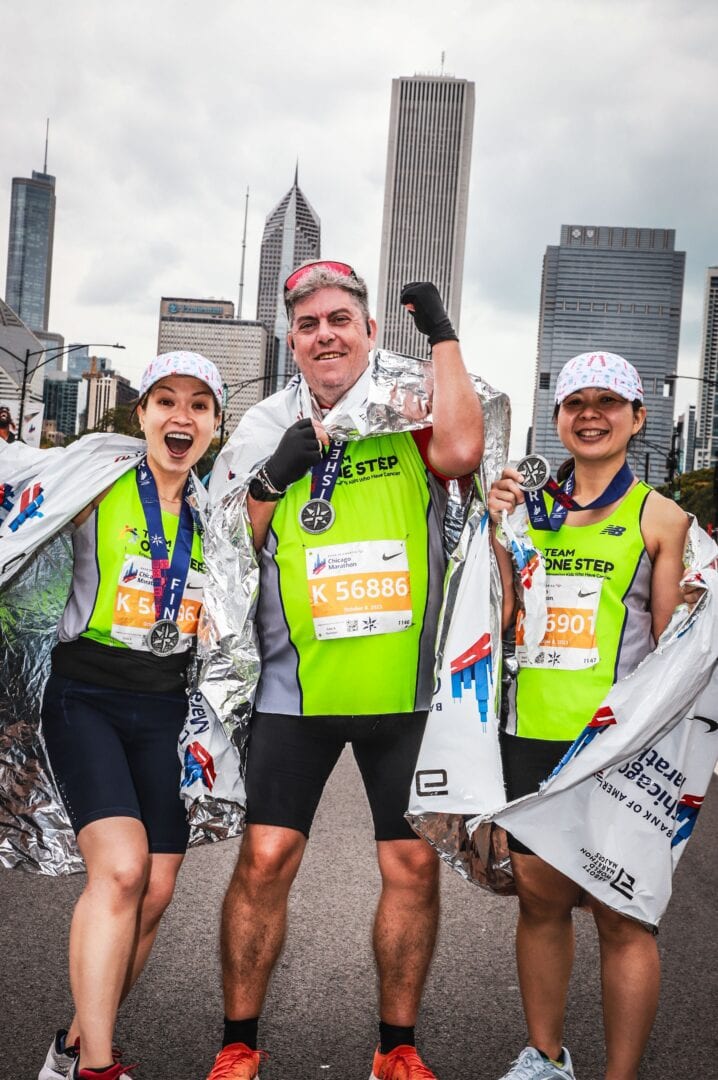 Inspiring marathon finish with runners celebrating success at Chicago Marathon, showcasing endurance and achievement.