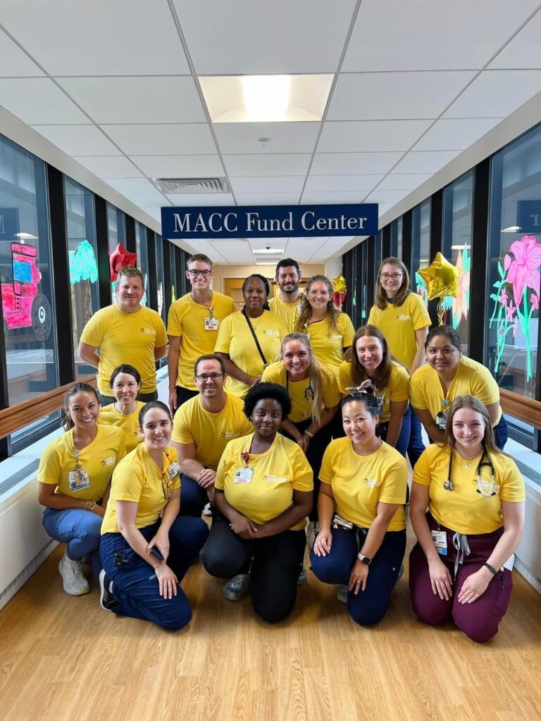 Medical staff group photo at Camp One Step, showcasing compassionate healthcare professionals.