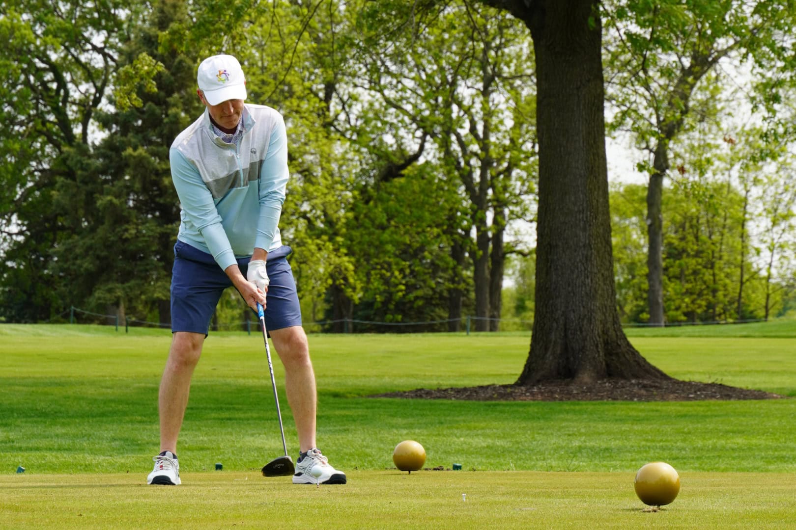 1. Golf player preparing to tee off at Camp One Step golf course.