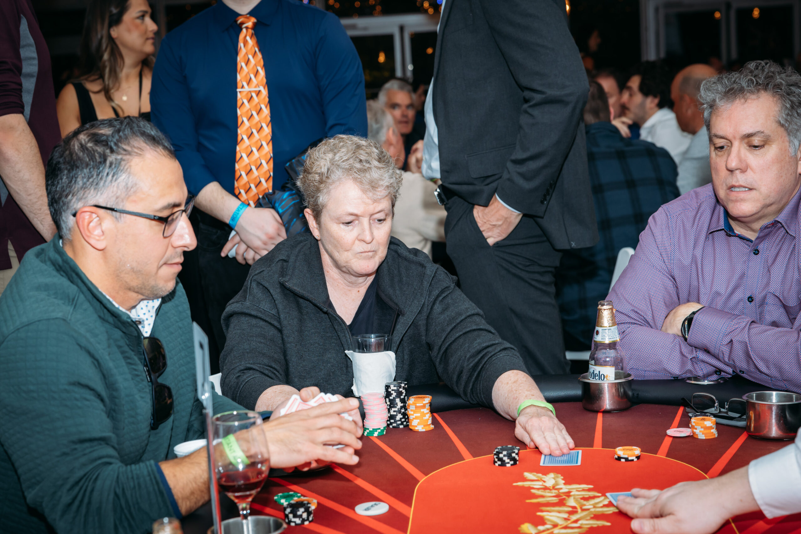 People playing poker at a casino table