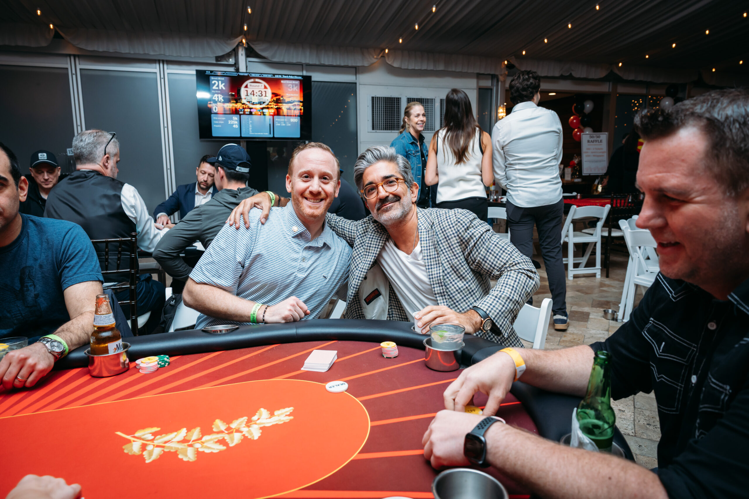Men smiling at a lively poker game