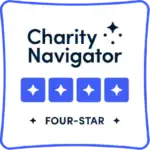 Bright outdoor camp site with tents and trees at Camp One Step, offering youth camping experiences.