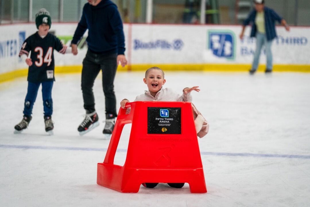 Child enjoying ice skating rink at Camp One Step.