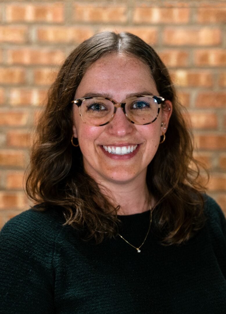 Girl smiling at Camp One Step outdoor camp.