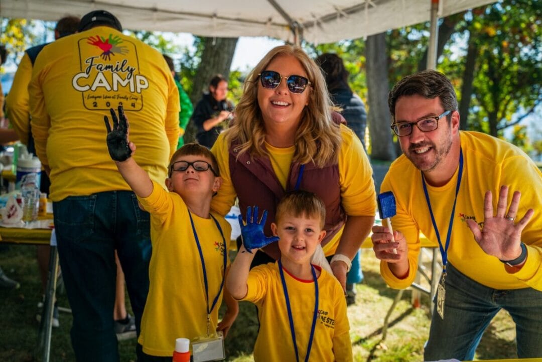 Kids and adults enjoying outdoor family camp activities at Camp One Step in nature.