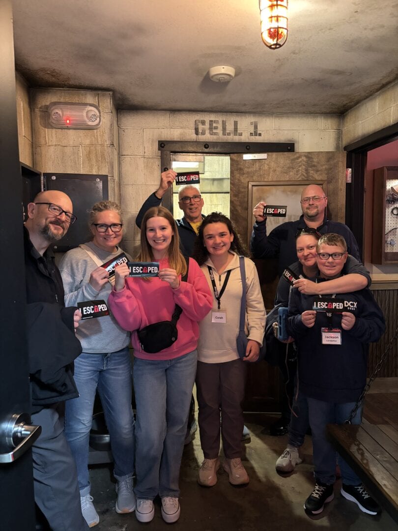 Escape room team enjoying Camp One Step adventure.