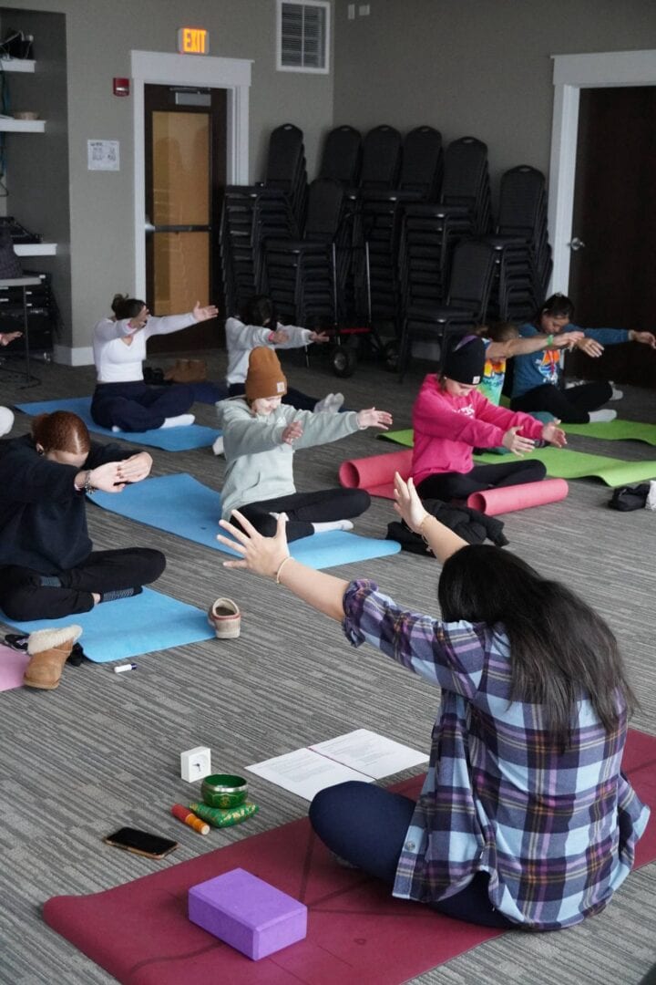 Yoga class with children at Camp One Step outdoor retreat.