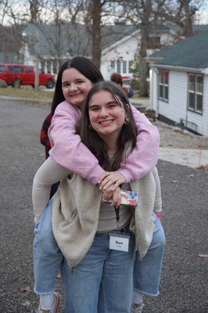 Smiling young women enjoying outdoor camp activity at Camp One Step.