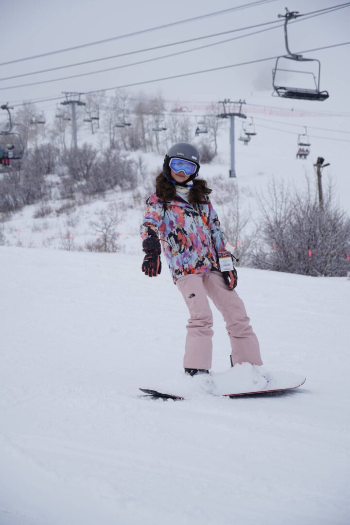 Snowboarding at Camp One Step, winter outdoor activity for kids and families.