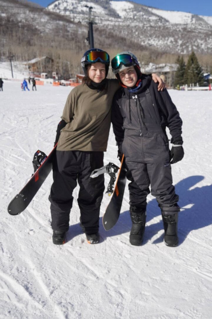 Kids enjoying skiing at Camp One Step winter camp.
