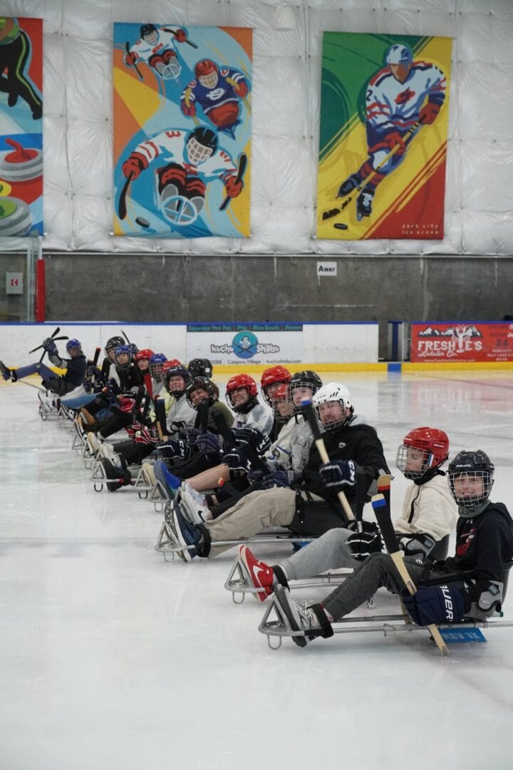 Skating rink ice hockey training session at Camp One Step with young players in gear.