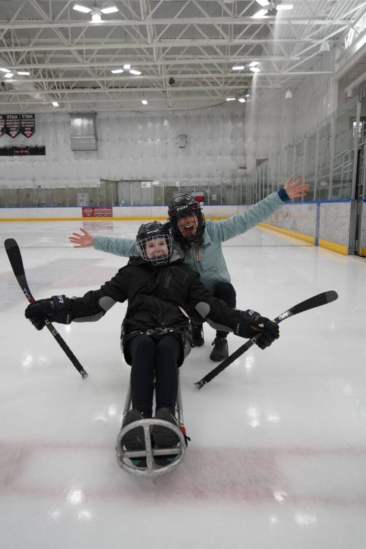 Smiling kids at indoor ice skating rink, enjoying fun hockey activity, smile, friends, cold, sports, recreation, Camp One Step.