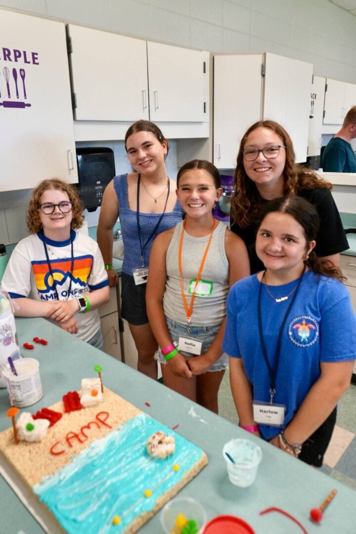 Group of smiling kids at summer camp fun activities.