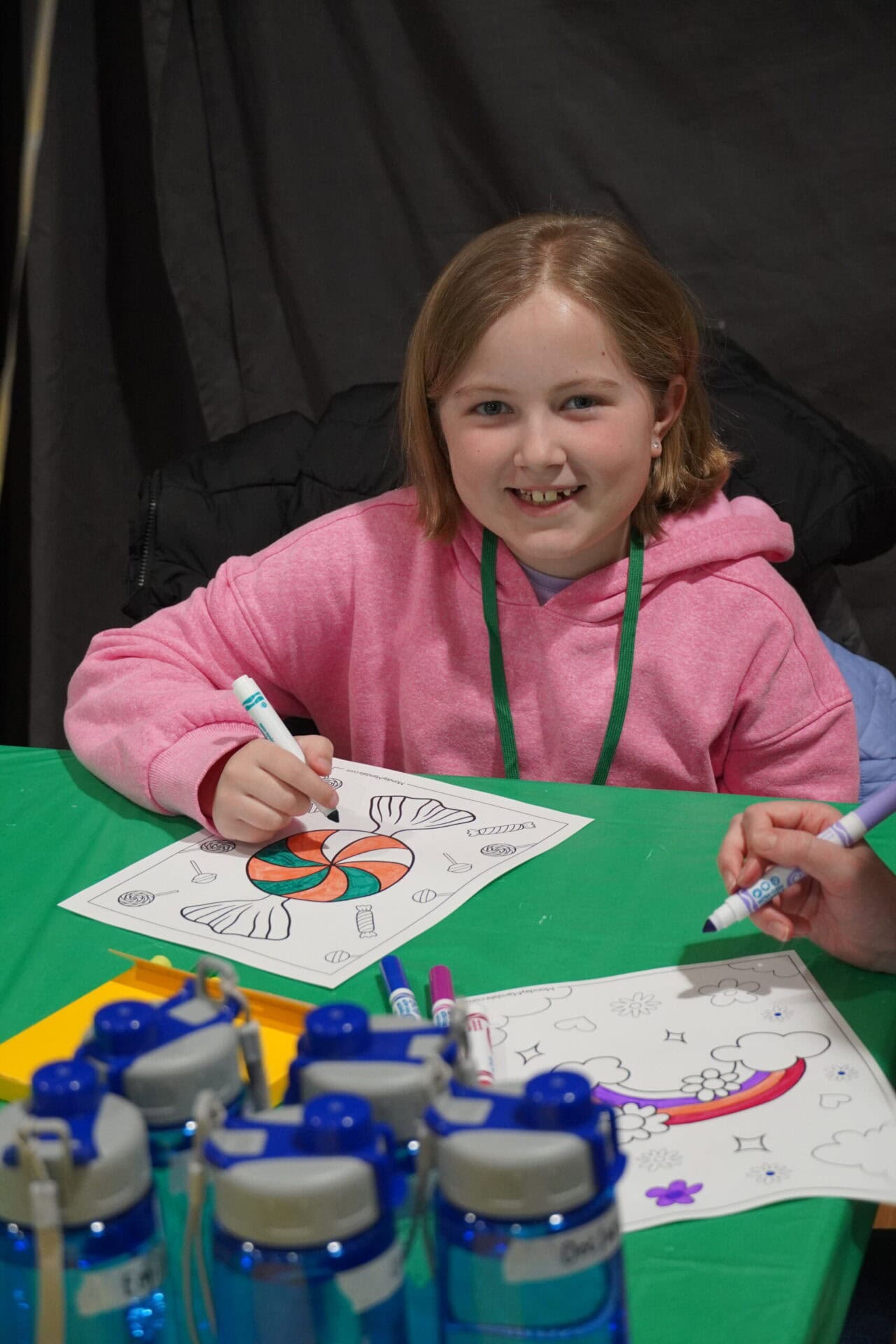 Coloring activity at Camp One Step for kids' fun and creativity in a summer camp setting.