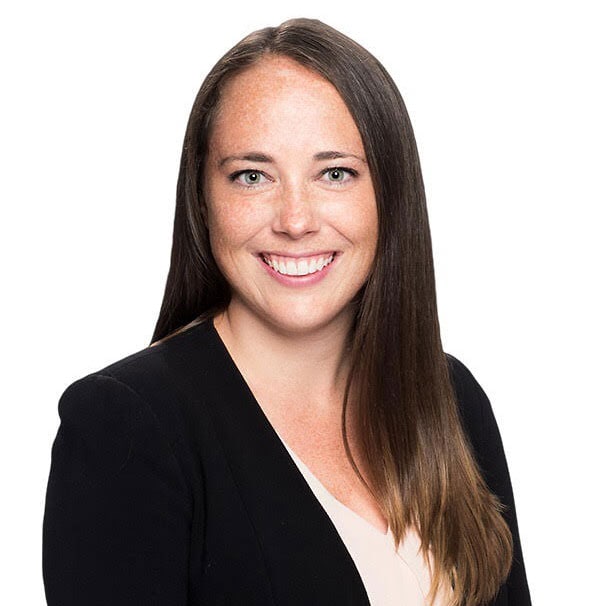 Friendly woman smiling, professional portrait for Camp One Step outreach and support.