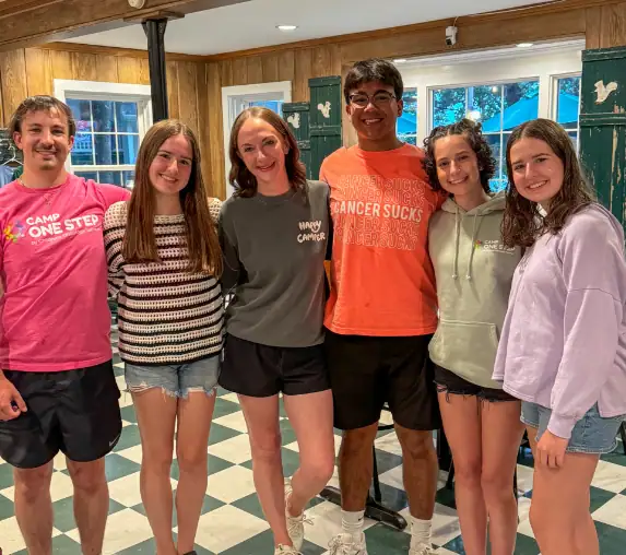 1. Diverse group of teens at Camp One Step enjoying fun cabin activities and bonding.