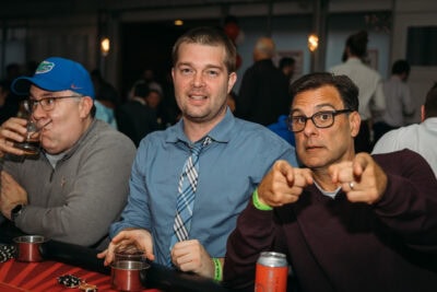 Joyful group at Camp One Step charity event supporting children with cancer.