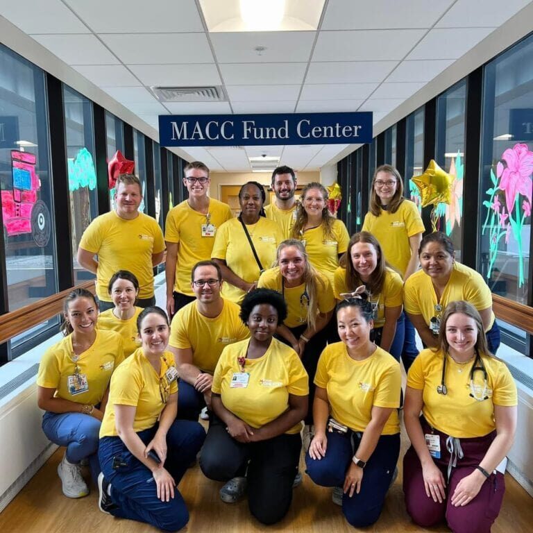 Medical staff group photo at Camp One Step, showcasing compassionate healthcare professionals.