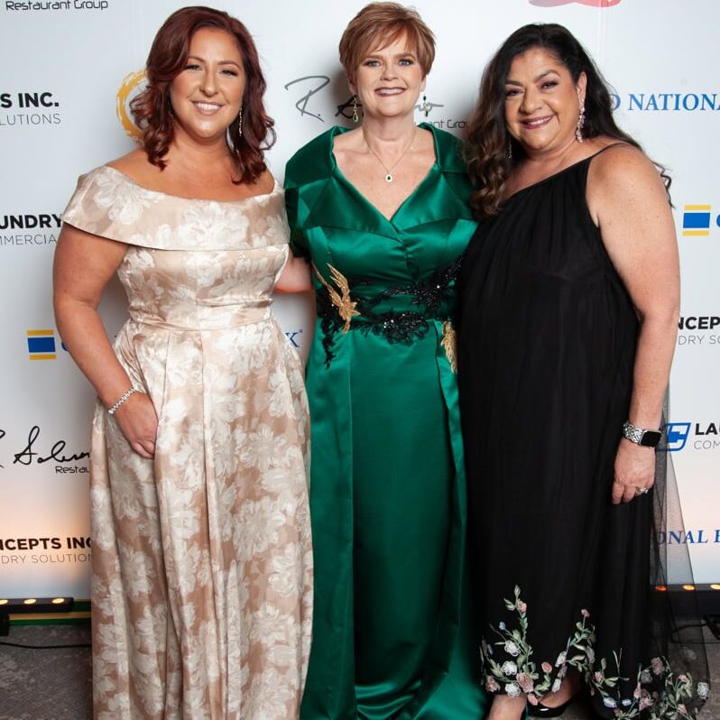 Event with women at a charity or fundraising gathering described.