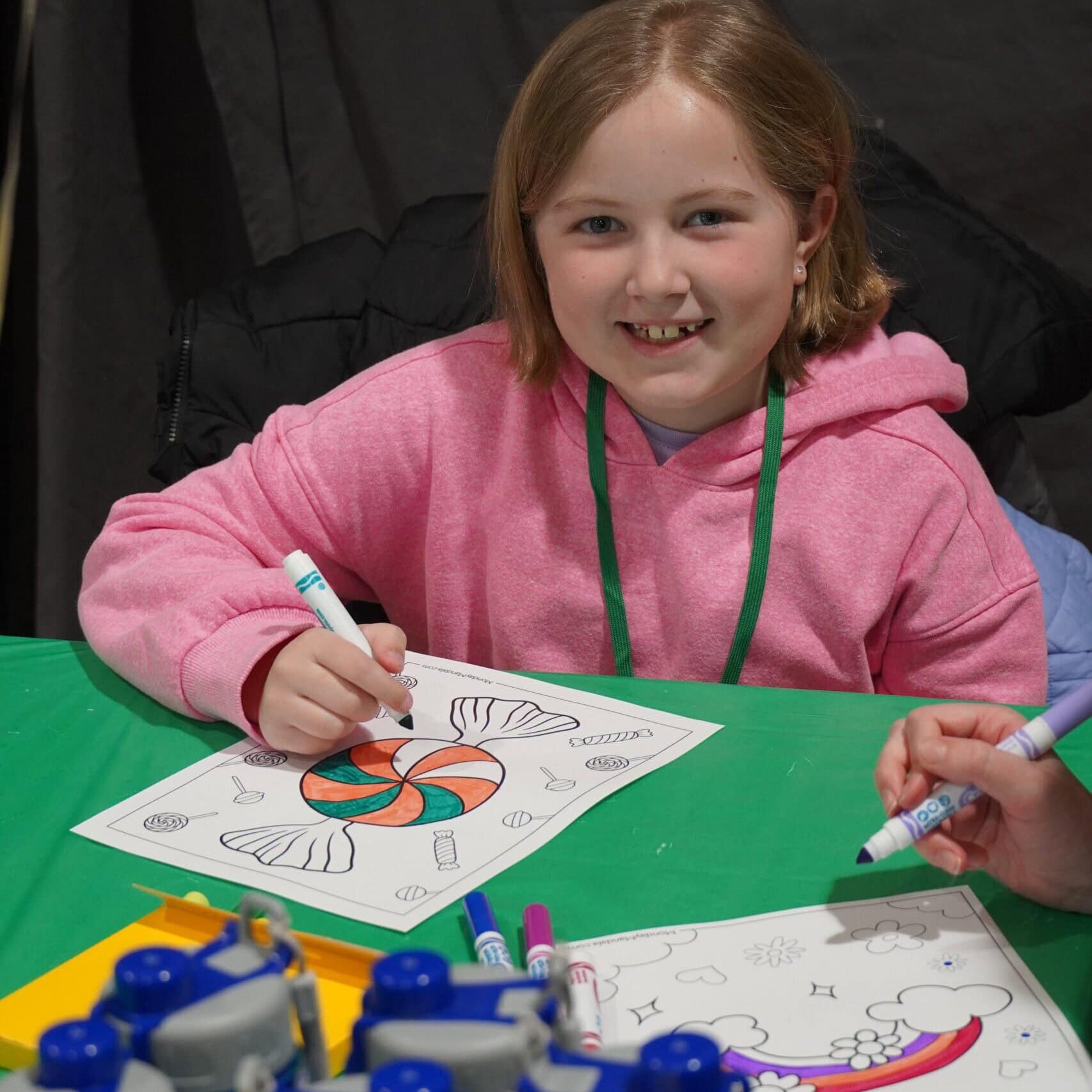 Coloring activity at Camp One Step for kids' fun and creativity in a summer camp setting.