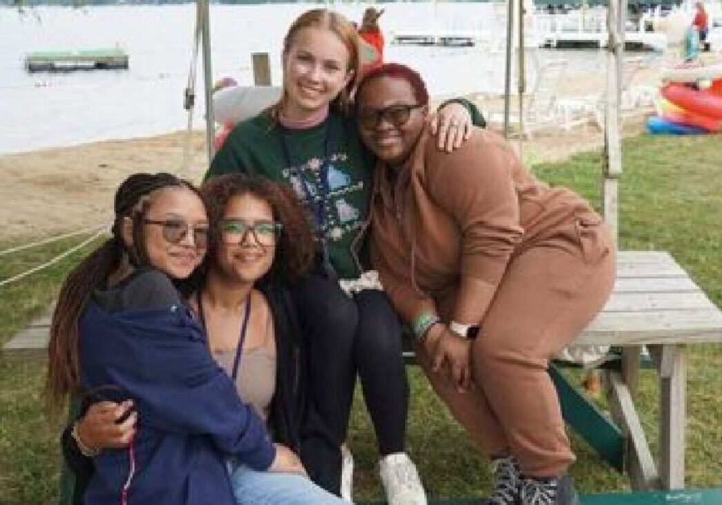 Joyful group of diverse women at Camp One Step outdoor activity, promoting inclusion and community engagement.